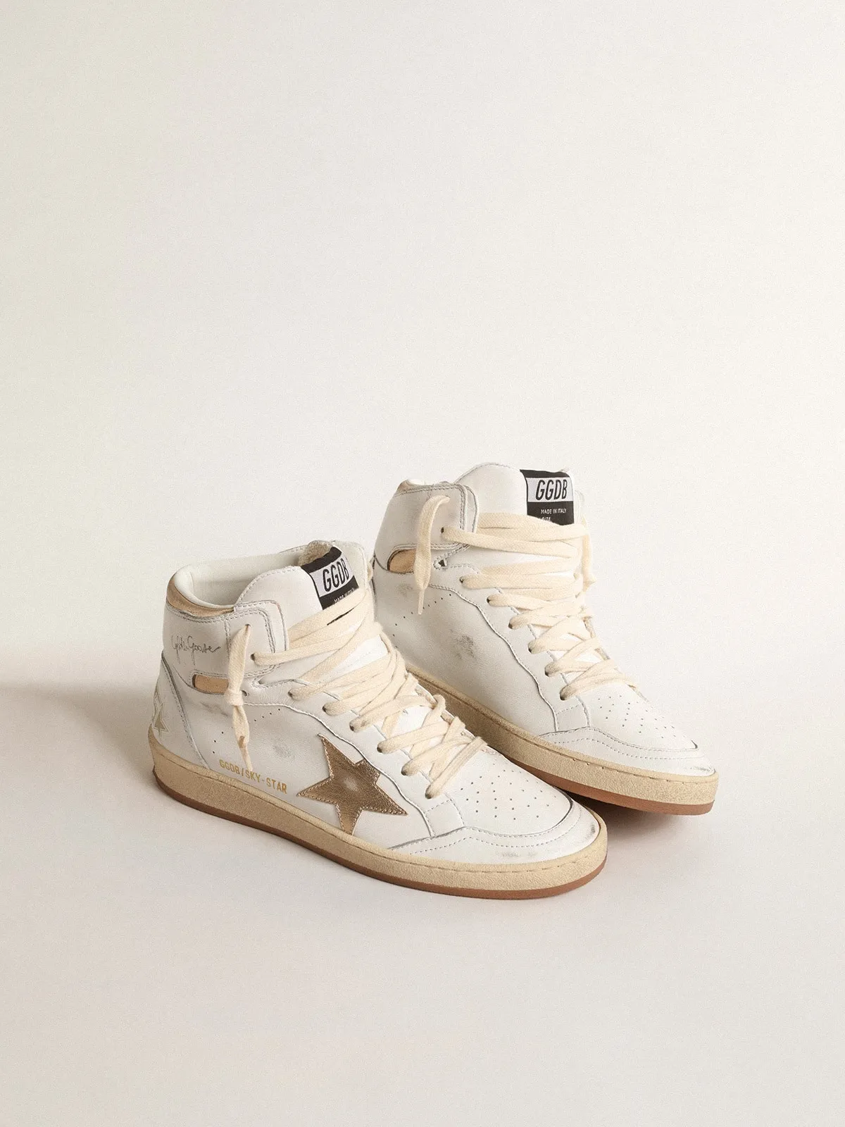 Sky-Star in nappa bianca con stella e talloncino in pelle laminata oro